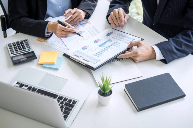 Business owner in consultation meeting discussing outsourced CFO services and pricing